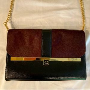 C. Wonder deep burgundy and black clutch
